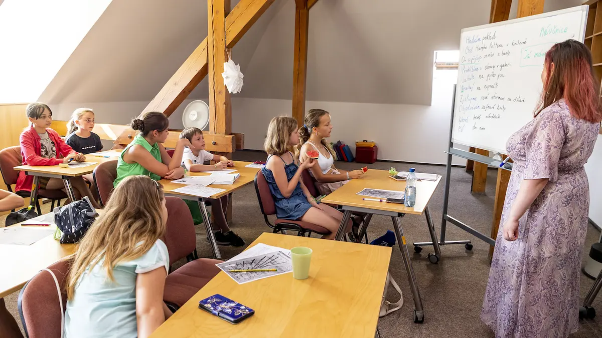 They study even during the holidays.  Ukrainian children practice Czech at summer camp